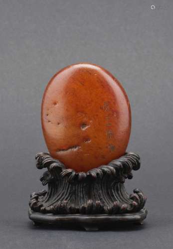 An agate naturalistic ‘egg’ boulder with zitan stand