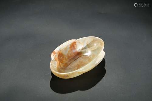 A pale yellow jade winged oval cup