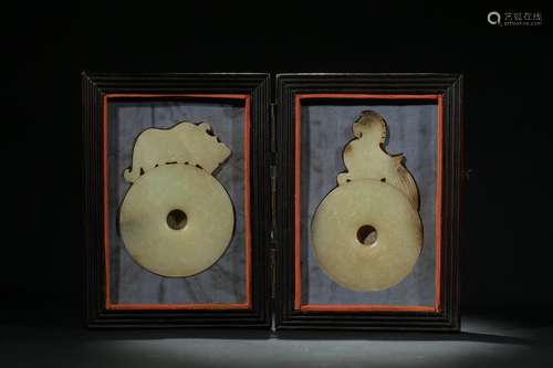 A pair of celadon jade 'mythical beast' archaistic pendants