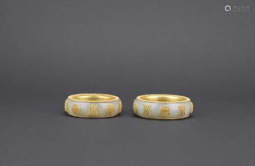 A pair of white jade gold bead inlaid 'shou' bangles