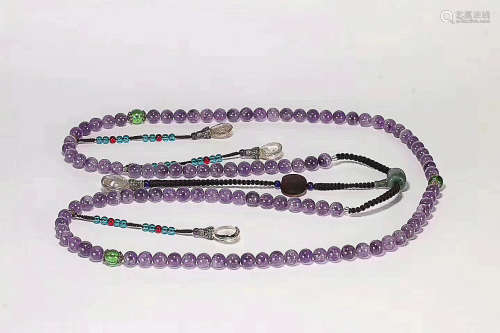 A PURPLE CRYSTAL COURT BEADS