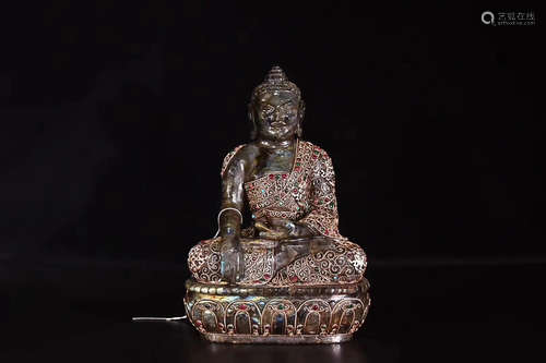 A LABRADORITE SAKYAMUNI FIGURE