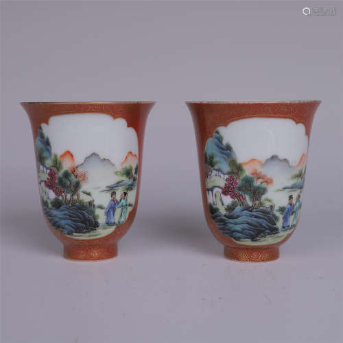 PAIR OF CHINESE PORCELAIN RED GROUND FAMILLE ROSE CUPS