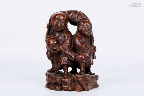 A chinese hardwood carved statue