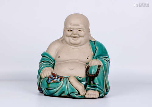 A chinese porcelain buddha statue