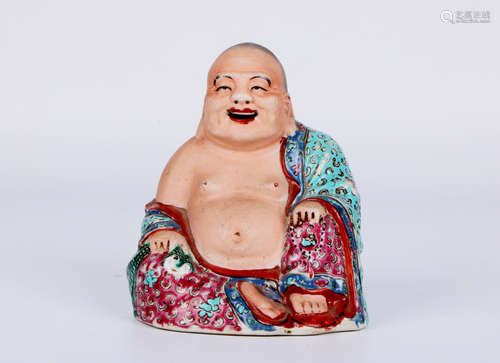 A chinese porcelain buddha statue