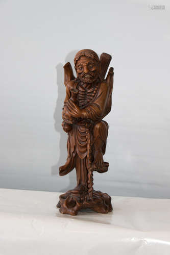 A chinese wood carved statue