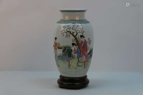 A chinese porcelain bottle with wood base