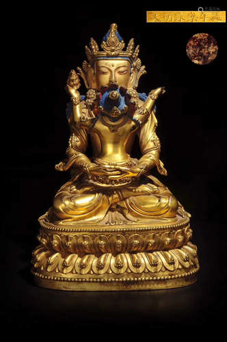 A GILT BRONZE MOLDED BUDDHA STATUE