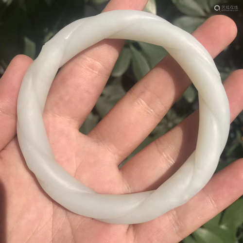 A HETIAN JADE CARVED BANGLE