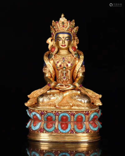 A GOLDEN MOLDED BUDDHA STATUE