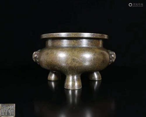 A BRONZE MOLDED TRIPOD CENSER WITH MARK