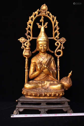 A GLIT-BRONZE BUDDHA FIGURE