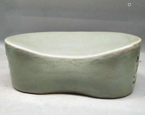 A TIANQING CELADON HOLLOW DESIGN PILLOW