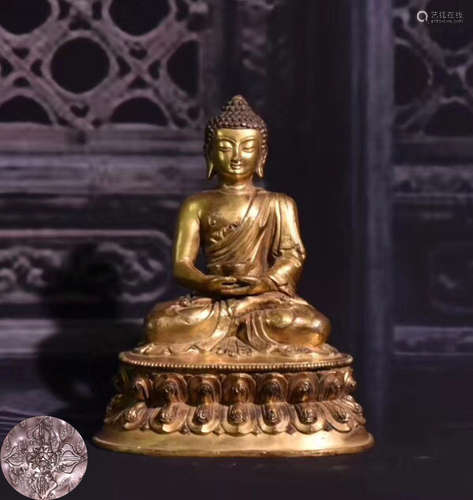 A GILT BRONZE MOLDED BUDDHA STATUE