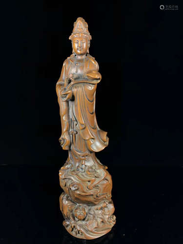 A HUANGYANG WOOD GUANYIN FIGURE