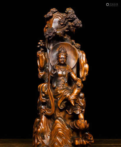 A HUANGYANG WOOD GUANYIN FIGURE