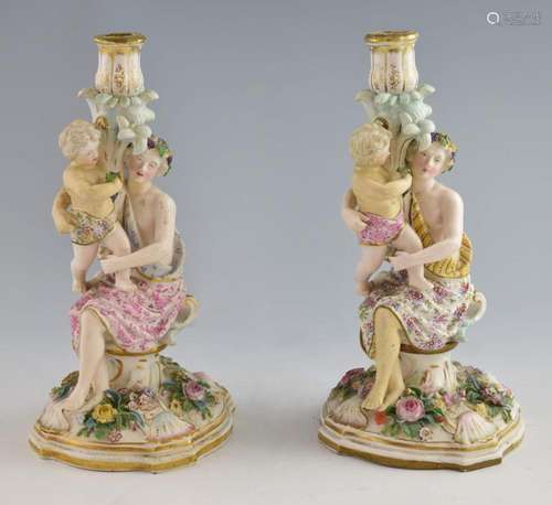 A pair of Meissen style figural candlesticks, earl