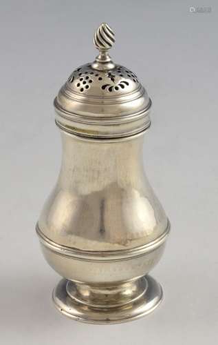 Silver pepperette of baluster form on round foot,