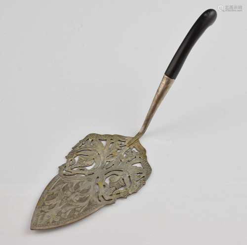 Far Eastern white metal cake slice with pierced an