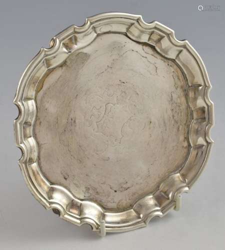 George II silver waiter with shaped border on thre