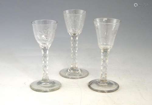 Three 18th century wine glasses, with flower and b