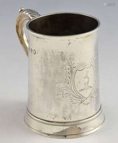 George III silver mug with scrolling handle, on ro