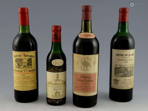 Four bottles of red wine; Chateau Cap Du Haut Moul