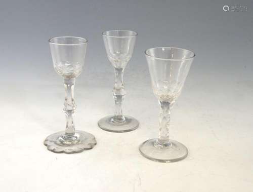 Three 18th century wine glasses, the bases of the