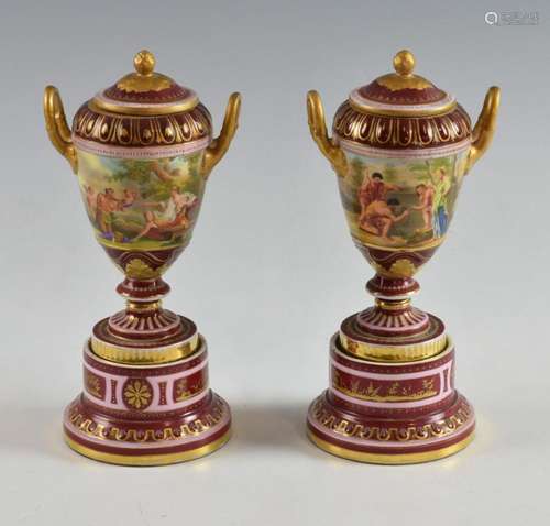 Pair of Continental porcelain urns and covers with