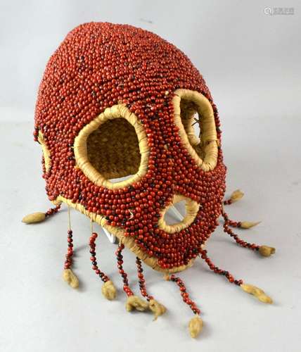 Nigerian Juju head mask, decorated with red beads