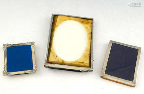 Three silver-mounted rectangular photograph frames