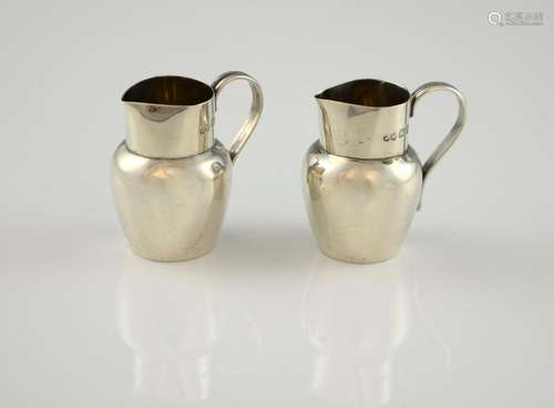 Victorian pair of miniature silver pitchers, with