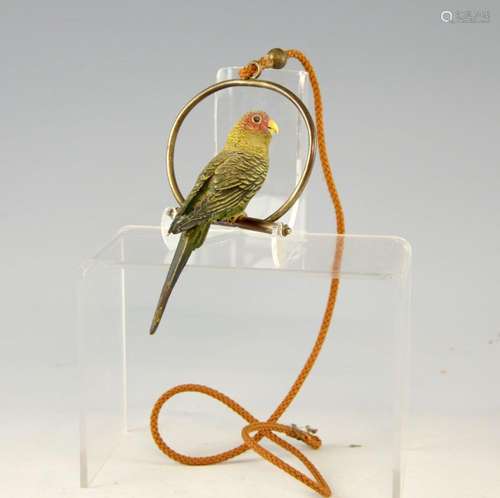 Cold painted bronze budgerigar on a swing, ( the b