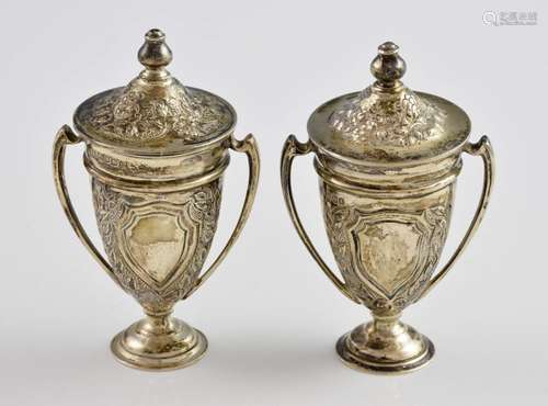 Pair of George V silver urn shaped jars and covers