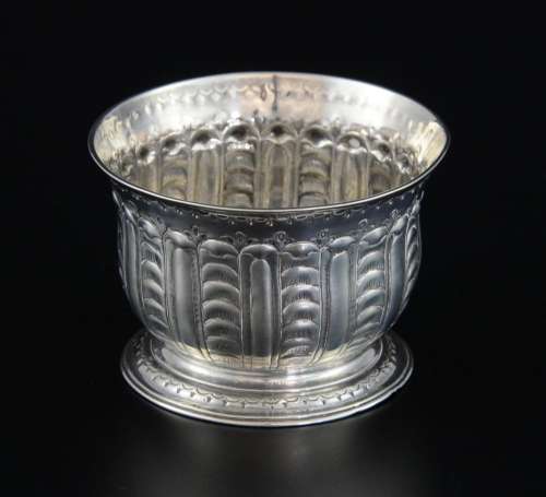Silver coloured metal bowl with embossed decoratio