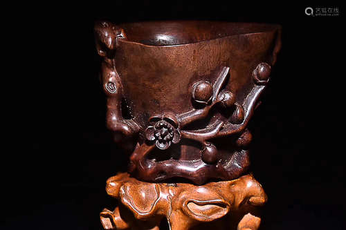 A HAINAN HUANGHUALI WOOD PLUM PATTERN CUP, LATE QING DYNASTY