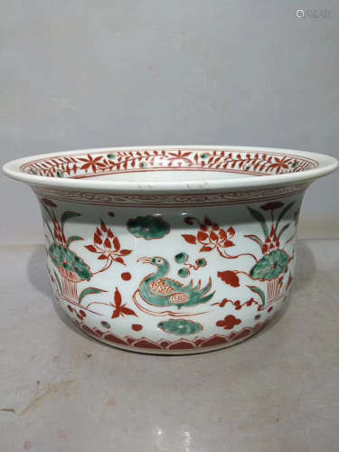 A RED AND GREEN COLOURED HAND BASIN