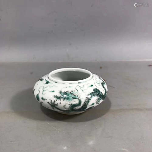 A GREEN COLORED DRAGON PATTERN WASHER