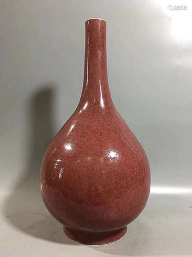 A RED GLAZED VASE