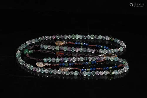 A STRING OF TOURMALINE COURT BEADS