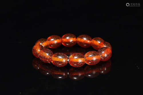 A AMBER JUJUBE SHAPED BEAD BRACELET, QING DYNASTY