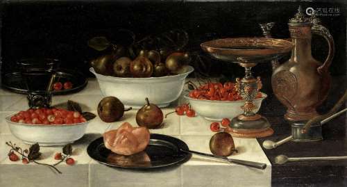 A still life with strawberries, pears and cherries in porcelain bowls, together  with a bread roll on a silver plate, a roemer, a tazza, a jug, two pipes and burning taper, all on a draped table-top School of Delft17th Century