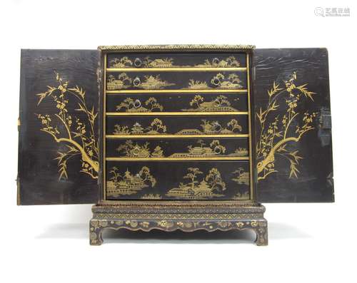 18th century A black and gilt lacquered table cabinet on stand