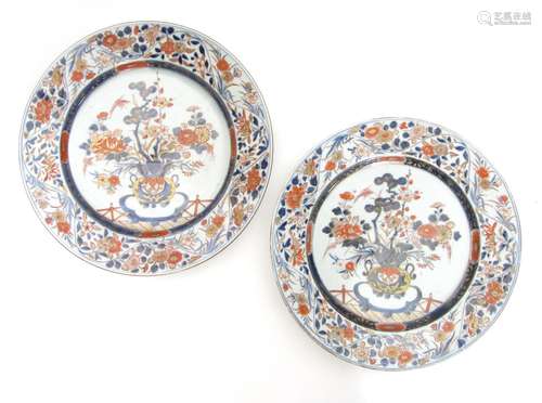 Circa 1700 A pair of large Imari chargers