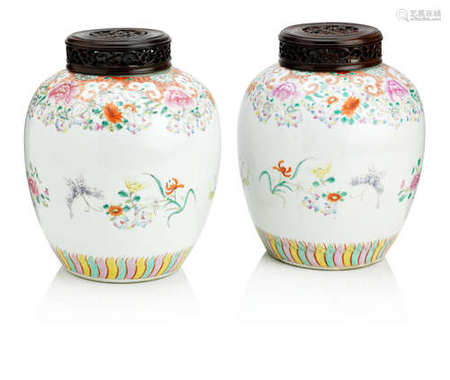 Qianlong six-character marks but circa 1900 A pair of famille rose jars and hardwood covers