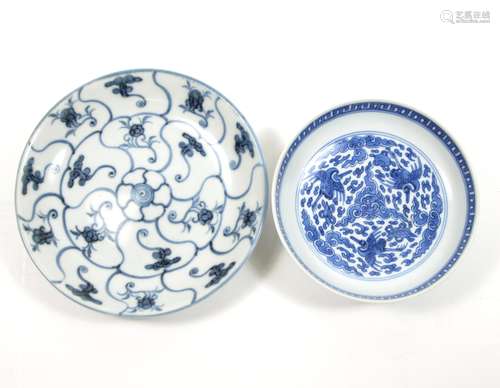 One bearing six-character Qi shi bao ding zhi zhen (Extremely precious as a treasured ding of rare jade) mark Two blue and white saucer dishes