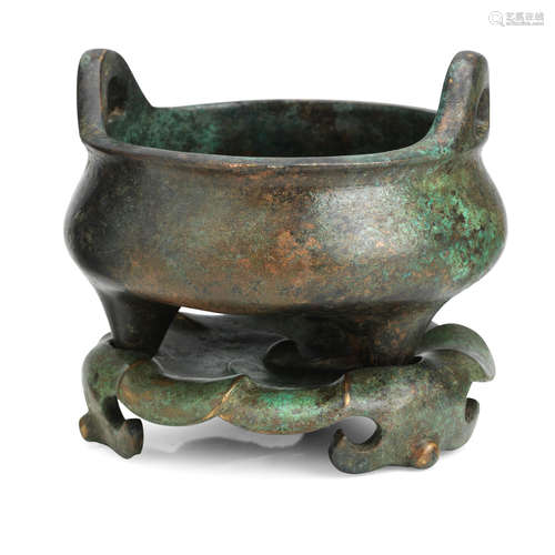 Xuande six-character mark but later A bronze tripod incense burner and matching 'lotus' stand