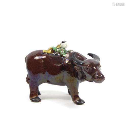 19th/20th century A glazed model of a boy-on-a-buffalo