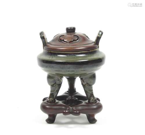 18th/19th century A glazed tripod incense burner with wooden cover and stand